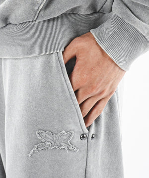 ブリーチスタッズロゴスウェットパンツ