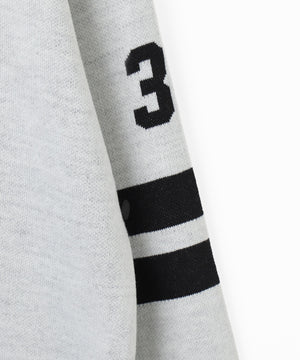 ナンバリングジャガードVネックニット